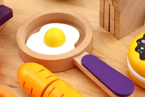 Wooden pretend play kitchen toy details, mini frying pan with fried egg, food cutting set for kids.