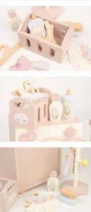 Kids wooden pretend play washing machine and laundry toy set with basket and miniature clothes.