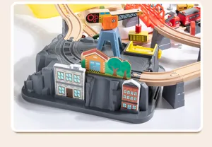 Wooden electric train track set with crane, bridge and blocks for kids early education.