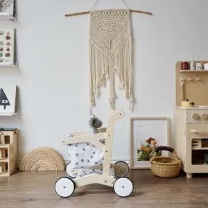 Detailed view of wooden children shopping cart walker toy with cute star pattern fabric pouch.