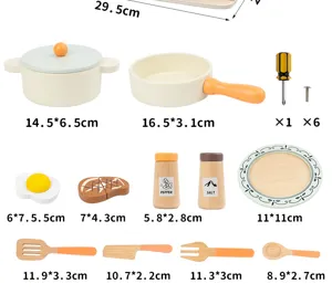 Wooden kitchen toy set detail view, showing mini wooden cooking pots, tools and utensils.