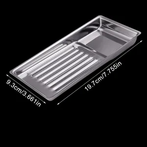 Stainless steel disinfection tray detail showing perforated draining slots and compact tool compartment.