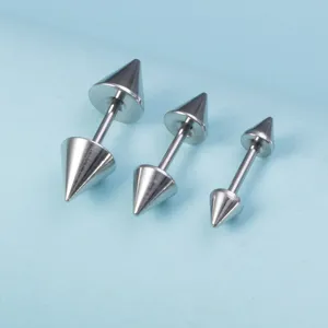 Stainless steel spike body piercing studs detail shot showing different sizes clearly.