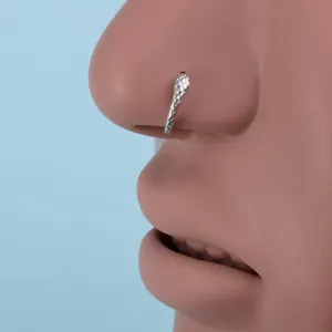 Stylish copper alloy geometric snake texture nose ring piercing body jewelry detail shot.