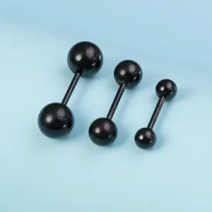 Black stainless steel body piercing barbell detail shot, featuring three different sizes.