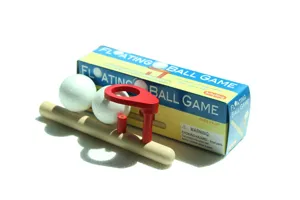 Wooden floating ball game detail view, classic wood pipe and styrofoam balls toy set.
