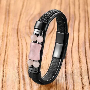 Detailed shot of men's vintage braided leather bracelet with pink crystal beads and clasp.