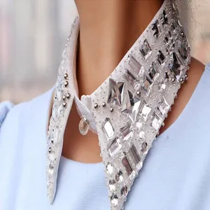 Detailed close-up of glittering rhinestone embellished detachable false collar accessory