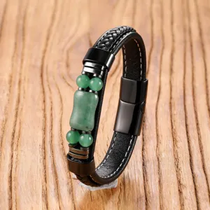 Close-up detail of vintage braided leather bracelet with green beads and steel magnetic clasp.