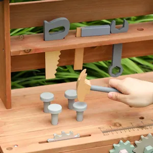 Wooden toy workbench for kids with tools, hammer, and interactive gears for educational play.