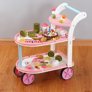 Wooden dessert cart toy detail, miniature play food set, pink and white trolley display.