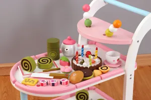 Wooden toy dessert cart detail, multi-tier trolley with wooden play food and cakes for kids.