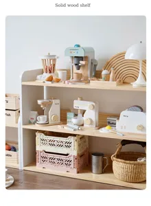 Detailed view of the solid wood toy storage shelf with various wooden play items and baskets.