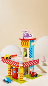 Detailed view of wooden parking lot toy with multi-level tracks, colorful cars and helicopter.