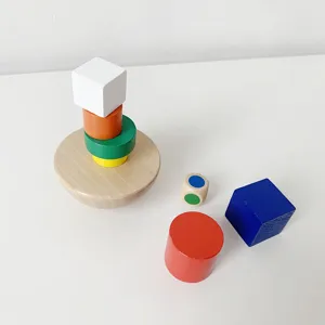 Wooden balance stacking toy set with semi-sphere base and colorful geometric blocks.