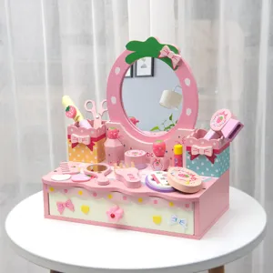 Wooden kids pretend play makeup vanity set with mirror, drawer and cute pink accessories.