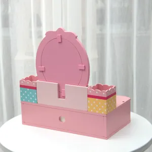 Wooden pretend makeup vanity toy detail showing pink color, mirror and polka dot storage boxes.