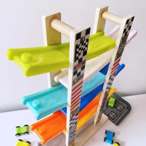 Wooden ramp racer toy detail showing colorful sliding tracks and miniature cars, natural wood.