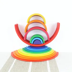 Wooden rainbow stacker detail showing colorful arch blocks and semi-circular pieces arranged nicely.