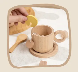 Wooden afternoon tea toy set detail showing a cute cup, saucer, spoon, and pretend toys.
