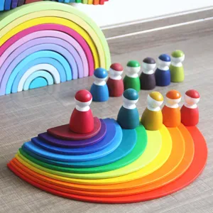 Wooden large rainbow building blocks semicircle set and wooden peg dolls educational detail.