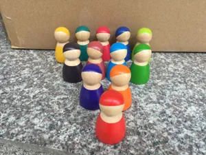 Colorful wooden peg dolls set, Montessori early education toys, smooth stacking figures.