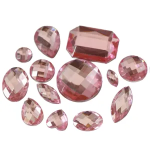 Detail shot of multi-shape pink acrylic flatback rhinestones, perfect for garment and craft decoration.
