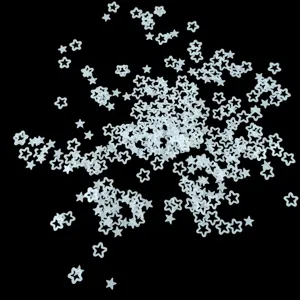 Translucent matte hollow star sequins for nail art DIY and resin crafts, close-up view.