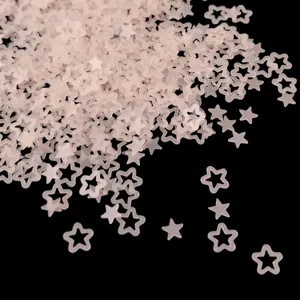 Close-up detail of translucent matte pink hollow star sequins for nail art and resin crafts.