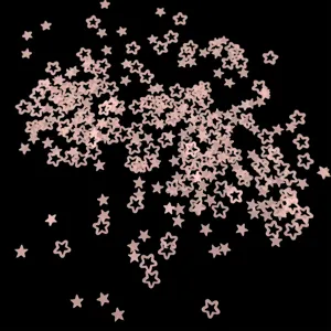 Close-up detail of pink hollow star glitter sequins for nail art and resin craft.