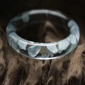 Clear resin dried flower bangle bracelet with blue petals and carved details for women daily wear.