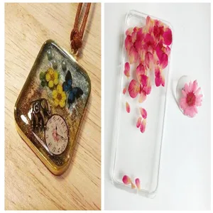 Handmade epoxy resin DIY craft pendant and pressed flower phone case detail showcase for craft lovers.