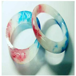 Handcrafted epoxy resin crystal clear bangles featuring vibrant red and blue ink art design.