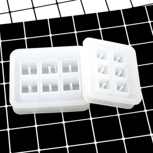 Detailed view of the 6-cavity square silicone mold with pins for DIY resin pendant crafts.