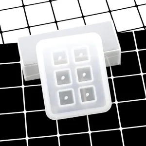Close up of 6-grid square silicone mold for epoxy resin DIY necklace pendant making.