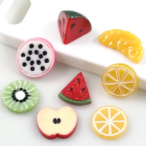 Detail view of mixed resin fruit slices for DIY phone case charms and cute crafts.