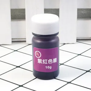 Close-up detail of a 10g purple-red resin dye bottle for UV epoxy crystal glue crafting projects.