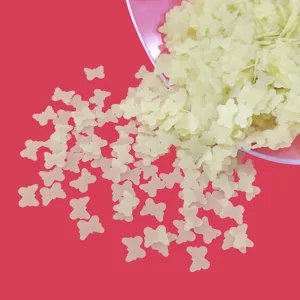 Close-up detail of matte hollow butterfly sequins for DIY crafts, nail art and resin filler.