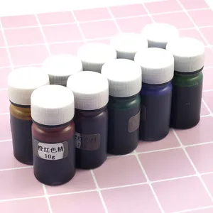 Resin pigment close-up view, small bottled colorant for epoxy and UV resin crafting.