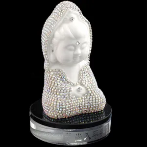 Exquisite rhinestone-encrusted ceramic deity figurine detail, sparkling crystals on clear base.