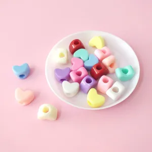 Colorful macaron heart beads close-up, perfect for DIY bracelets and necklaces making details.