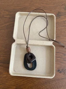 Retro ethnic coconut shell necklace with wooden beads and adjustable rope chain for women.