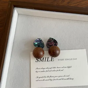 Vintage wooden and abalone shell heart earrings, delicate contrast stud earrings.