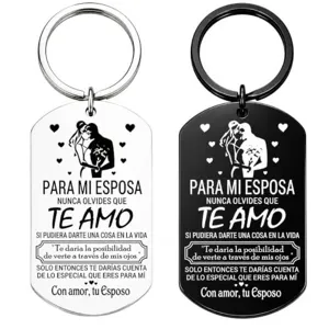 Stainless steel keychain detail shot, engraved romantic love quote text, couple silhouette design.