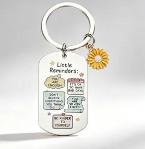 Stainless steel motivational keychain detail with cute sunflower charm and UV printed inspiring quotes.