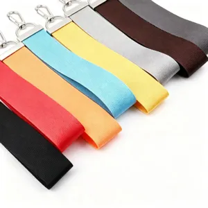 Detailed view of colorful fabric lanyards with silver metal clasps, perfect for keychains.
