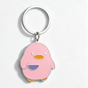 Detailed close-up of the cute pink duck metal keychain featuring a funny knife design.