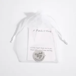 Stainless steel pocket hug token detail view, exquisite laser engraved coin with heart card.