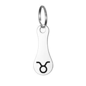 Stainless steel Taurus zodiac sign shopping cart token keychain pendant detail view.