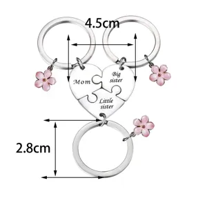 Stainless steel family puzzle keychain set for mother and sisters with cute pink flower charms.